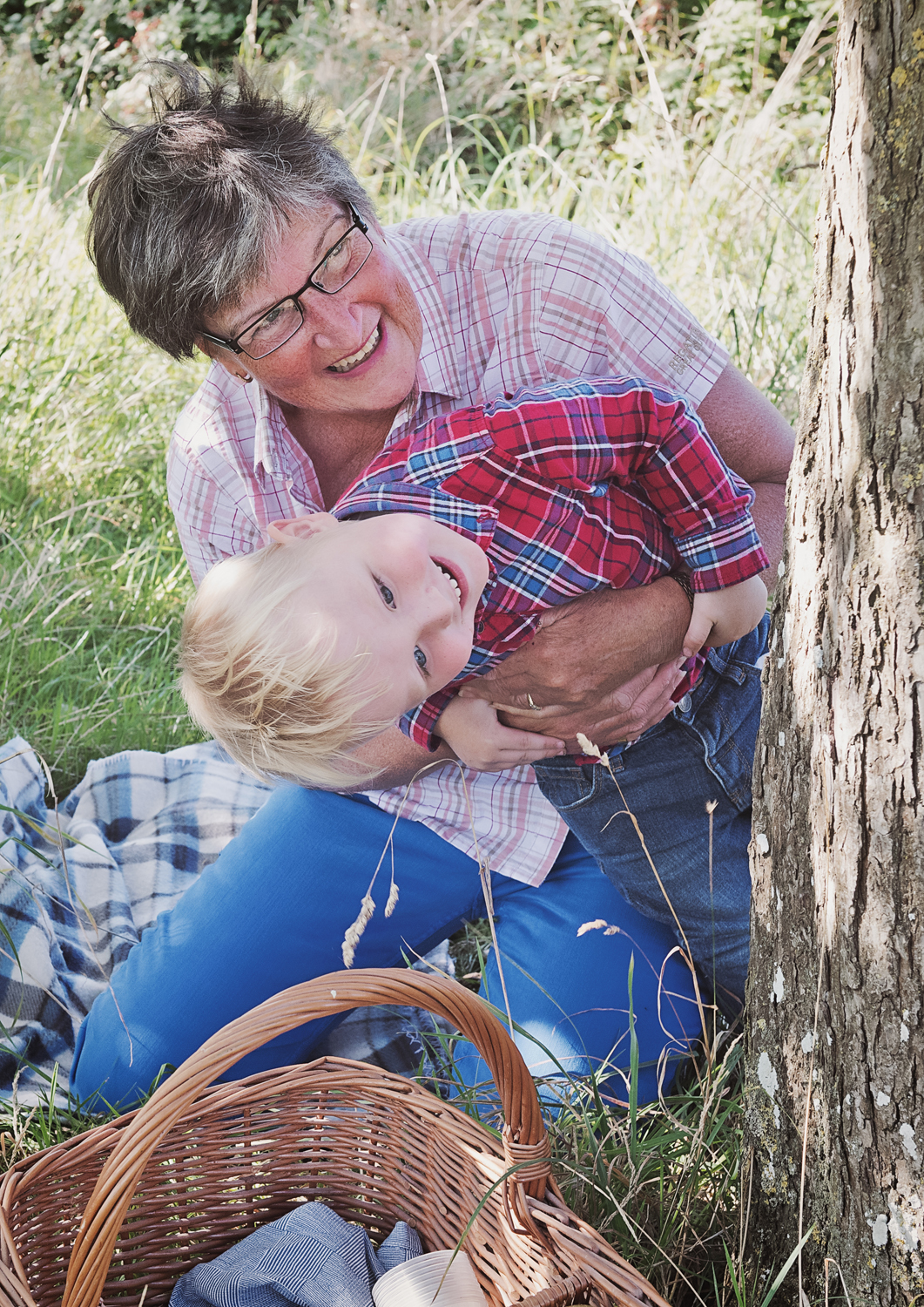 Family photo picking apples