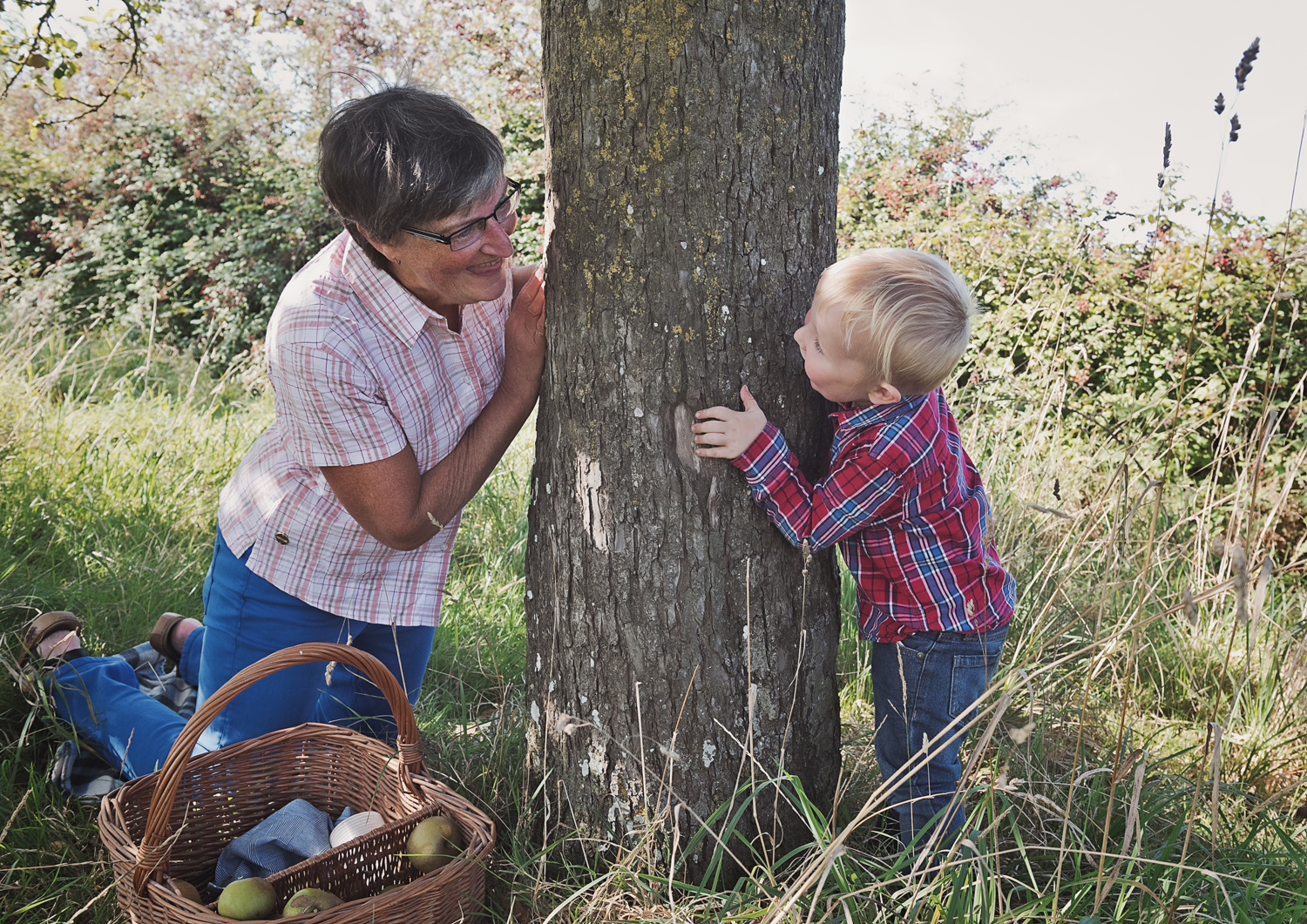 Family photo picking apples